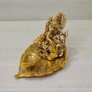 Lord Ganesha on Peepal Leaf with diya